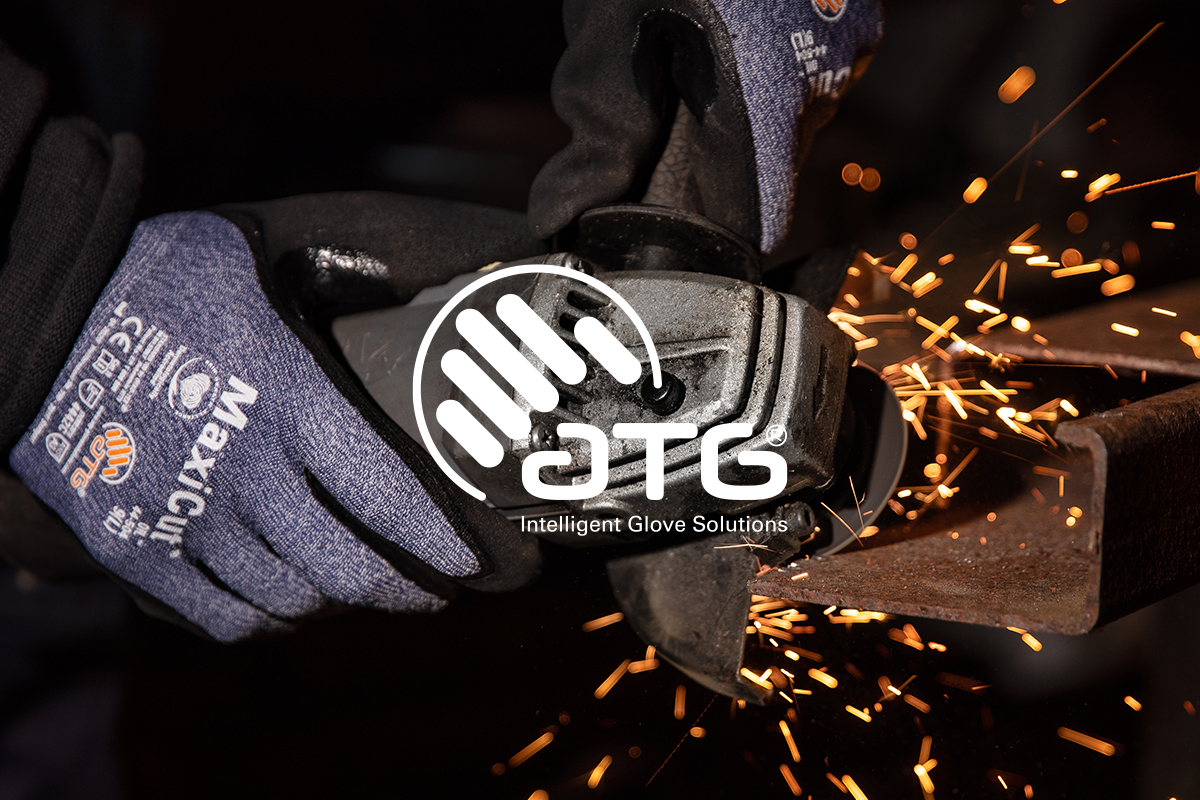 Hands in protective gloves using an angle grinder, sparks flying from a piece of metal. Clickable link to ATG products